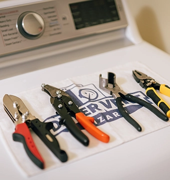 Tools on top of dryer.