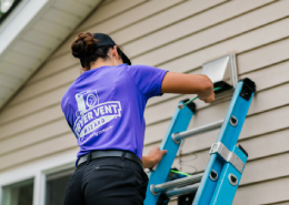 Technician cleaning out dryer.